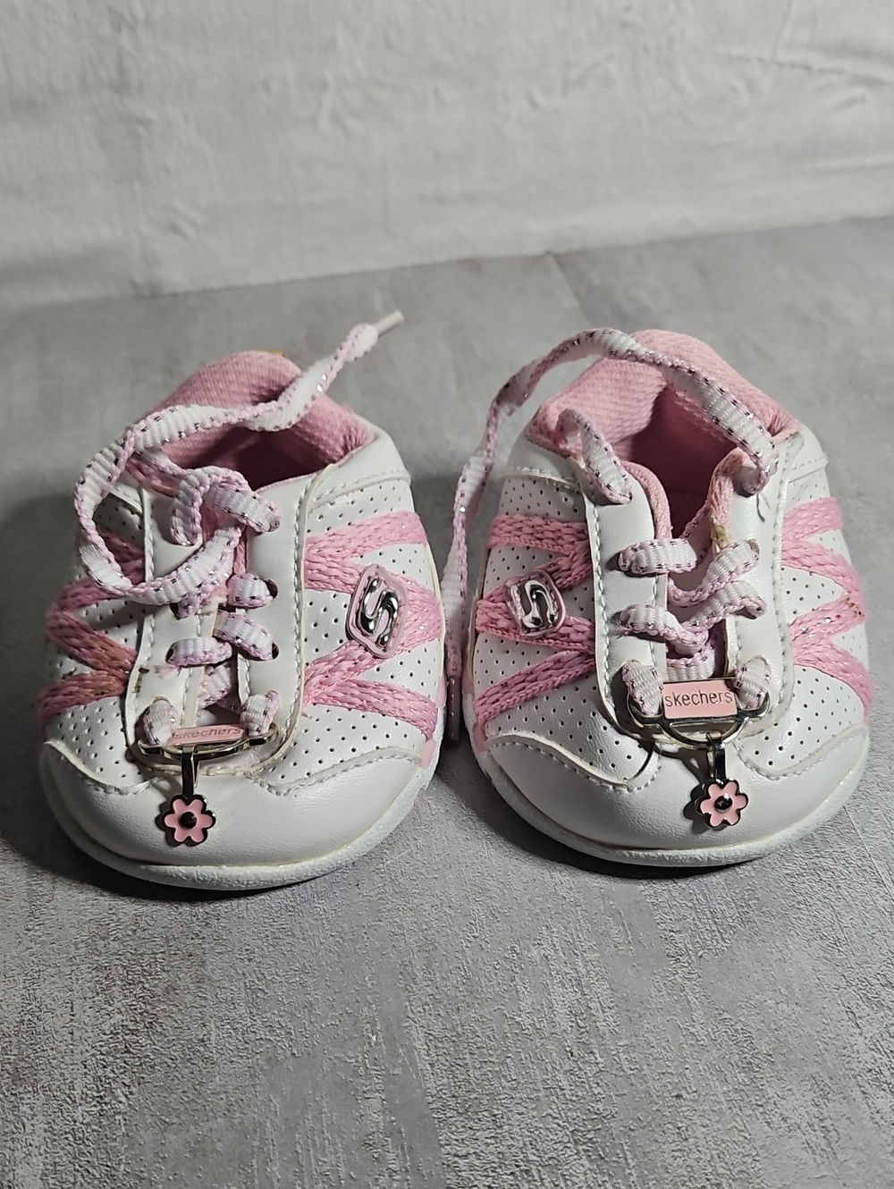 pair of pink and white Build-A-Bear Workshop Skechers